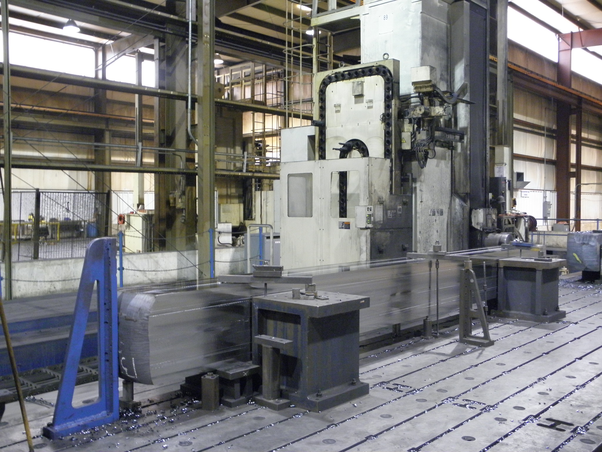 Large CNC machining of forged fluid end block - on CNC machine bed